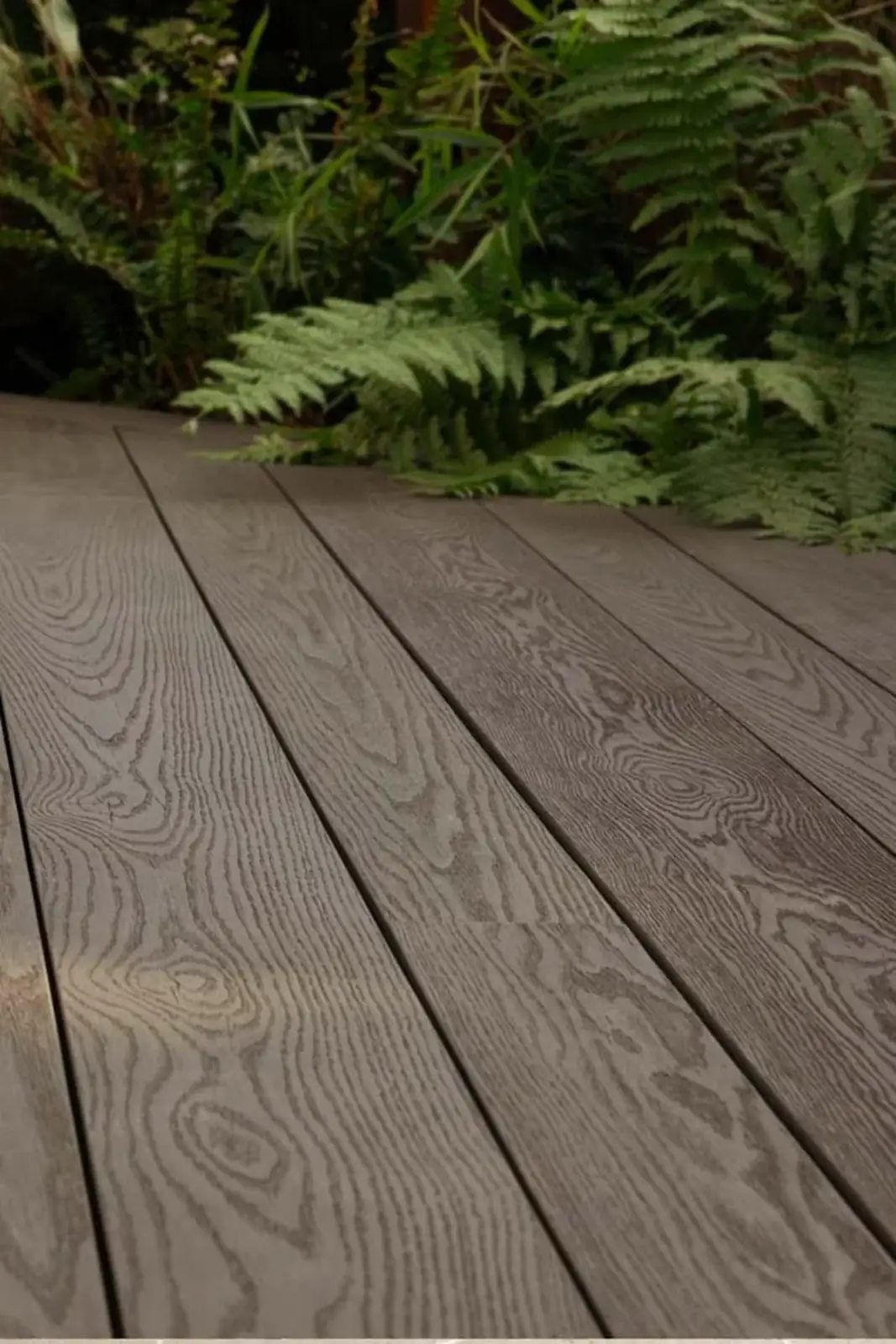 Custom composite deck built onto a home exterior