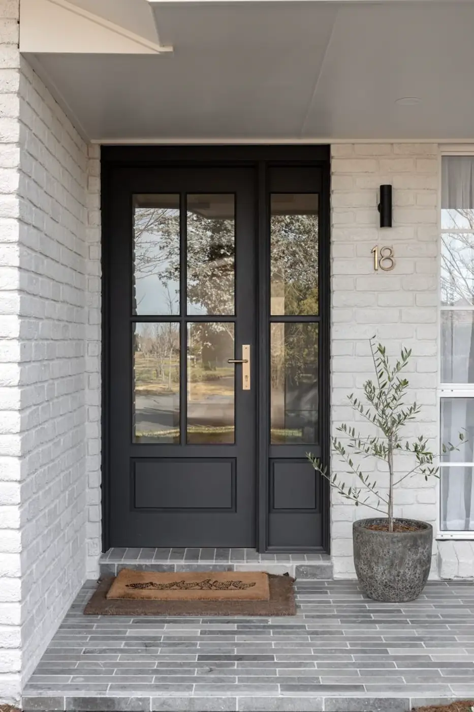Black front entry door with sidelight